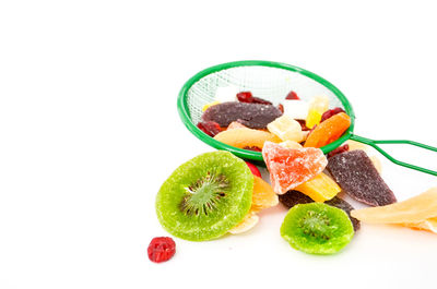 Close-up of multi colored fruits on white background