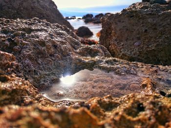 Close-up of water in sea against sky