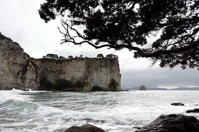 Scenic view of sea and rocks against sky