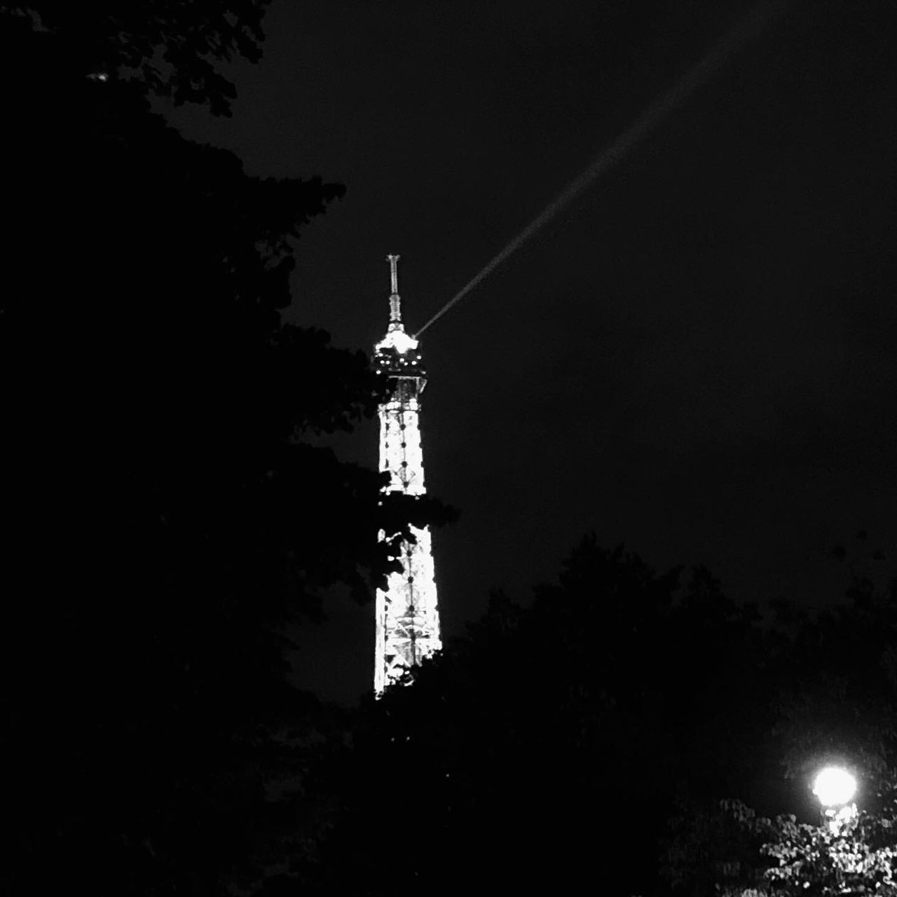 architecture, built structure, tower, building exterior, low angle view, sky, building, night, tree, plant, nature, no people, tall - high, illuminated, silhouette, outdoors, travel, lighthouse, travel destinations, guidance, spire