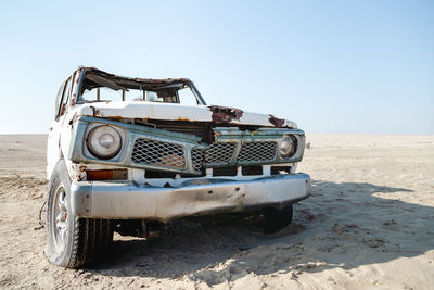 Car on road against clear sky