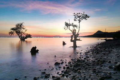 Scenic view of sea against sky during sunset