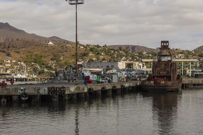 Boats moored at harbor