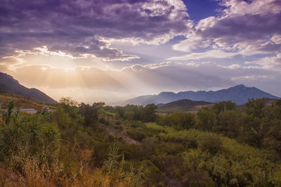 Scenic view of mountains against sky during sunset