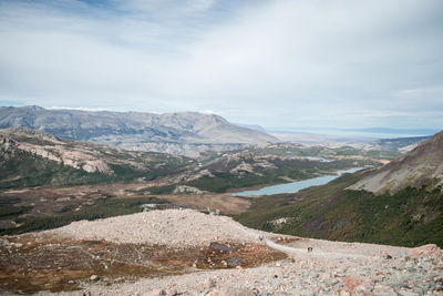 Scenic view of mountains against cloudy sky in autumn