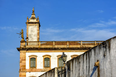 Low angle view of building against blue sky