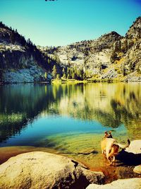 Scenic view of lake with mountains in background