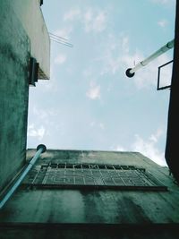Low angle view of building against cloudy sky