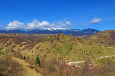 Scenic view of mountain range against cloudy sky