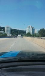 Road seen through car windshield