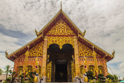 Low angle view of temple against building