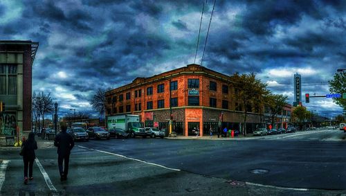 City street against cloudy sky