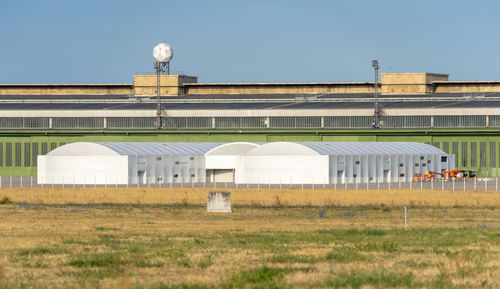 Built structure on field against clear sky