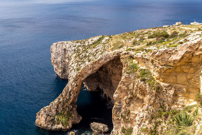 High angle view of rock formation in sea