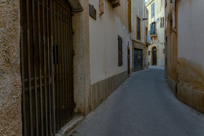 Empty alley amidst buildings