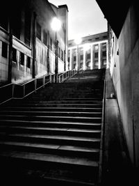 Staircase in city at night