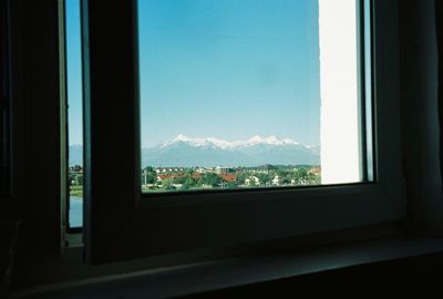 Scenic view of mountains seen through window