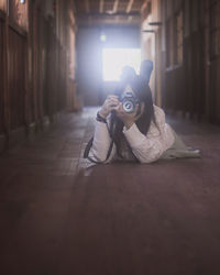 Portrait of man wearing hat on floor