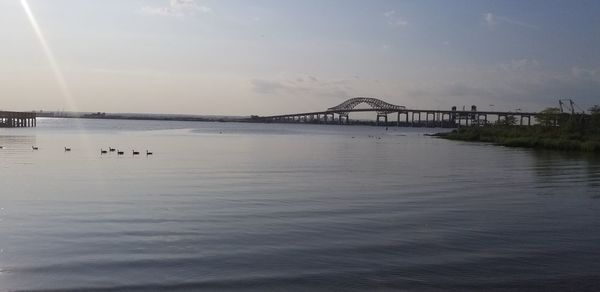 Bridge over river against sky