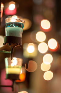 Close-up of illuminated tea light candles