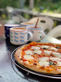 Close-up of pizza served on table