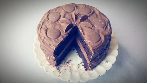 Close-up of pastry over white background