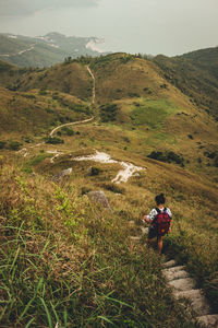 Full length of man on landscape against mountain range
