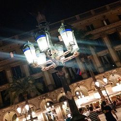 Low angle view of illuminated building at night