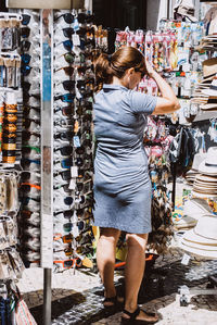 Full length of woman standing at market stall