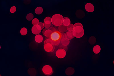 Defocused image of illuminated lights at night