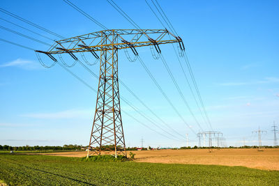 High-voltage power lines on a sunny day seen in germany