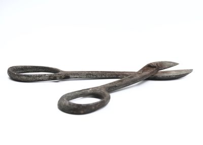 Close-up of metal object over white background