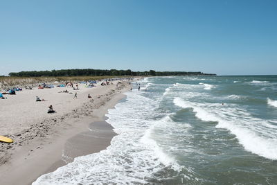 Panoramic view of beach against clear sky