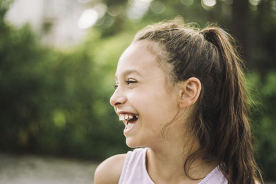 Cheerful girl looking away and laughing