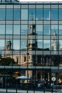Reflection of building on glass window
