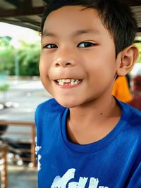 Close-up portrait of smiling boy