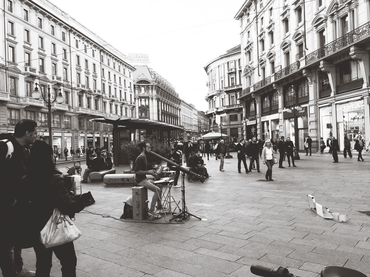 PEOPLE WALKING ON STREET IN CITY