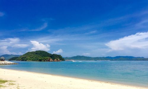 Scenic view of sea against blue sky