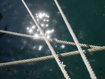 High angle view of rope tied on water