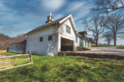 House on field against sky