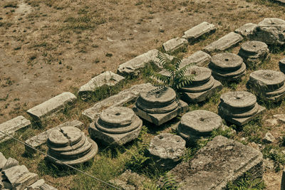 High angle view of stack of stones on field