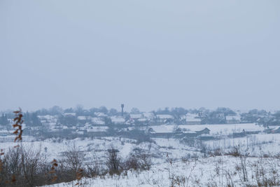 Buildings against clear sky during winter