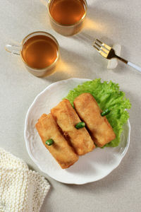 Sosis solo, minced chicken with egg crepe wrap and shape like sausage. 