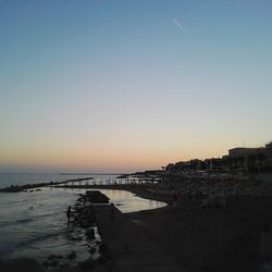 Scenic view of calm beach against sky