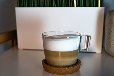 Close-up of coffee cup on table