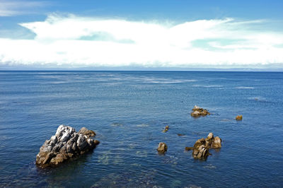 Scenic view of sea against cloudy sky