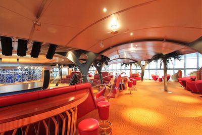 Empty chairs and tables in restaurant