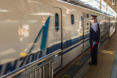 Blurred motion of train at railroad station