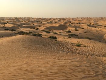 Scenic view of desert against clear sky