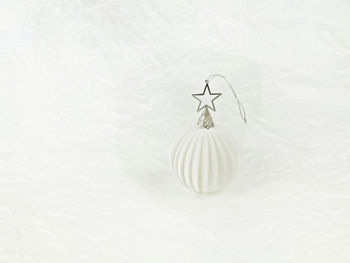 Close-up of christmas ornament against white background